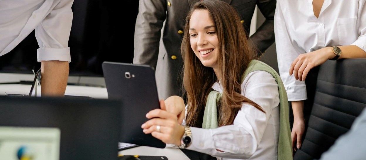 colleagues looking at a tablet