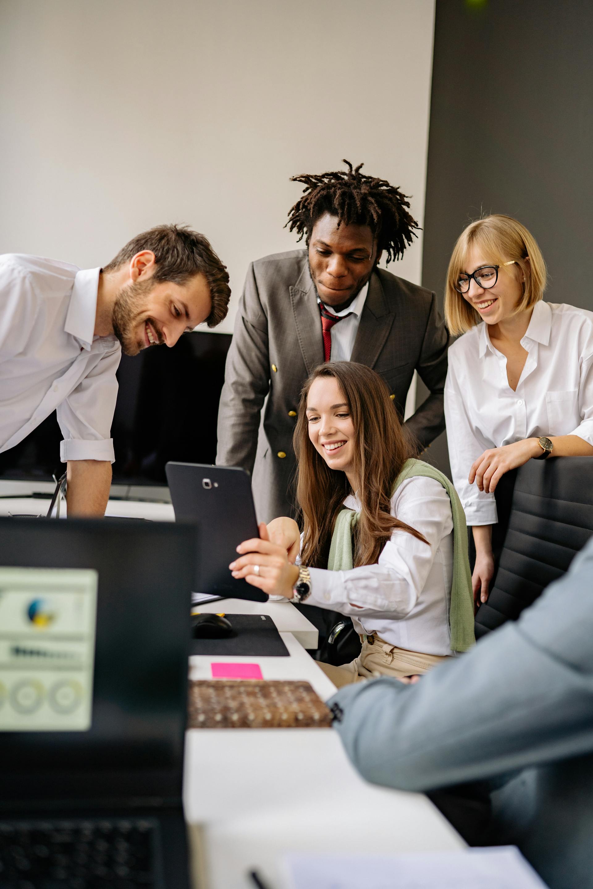 colleagues looking at a tablet